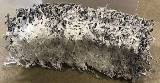 shredded material in briquette